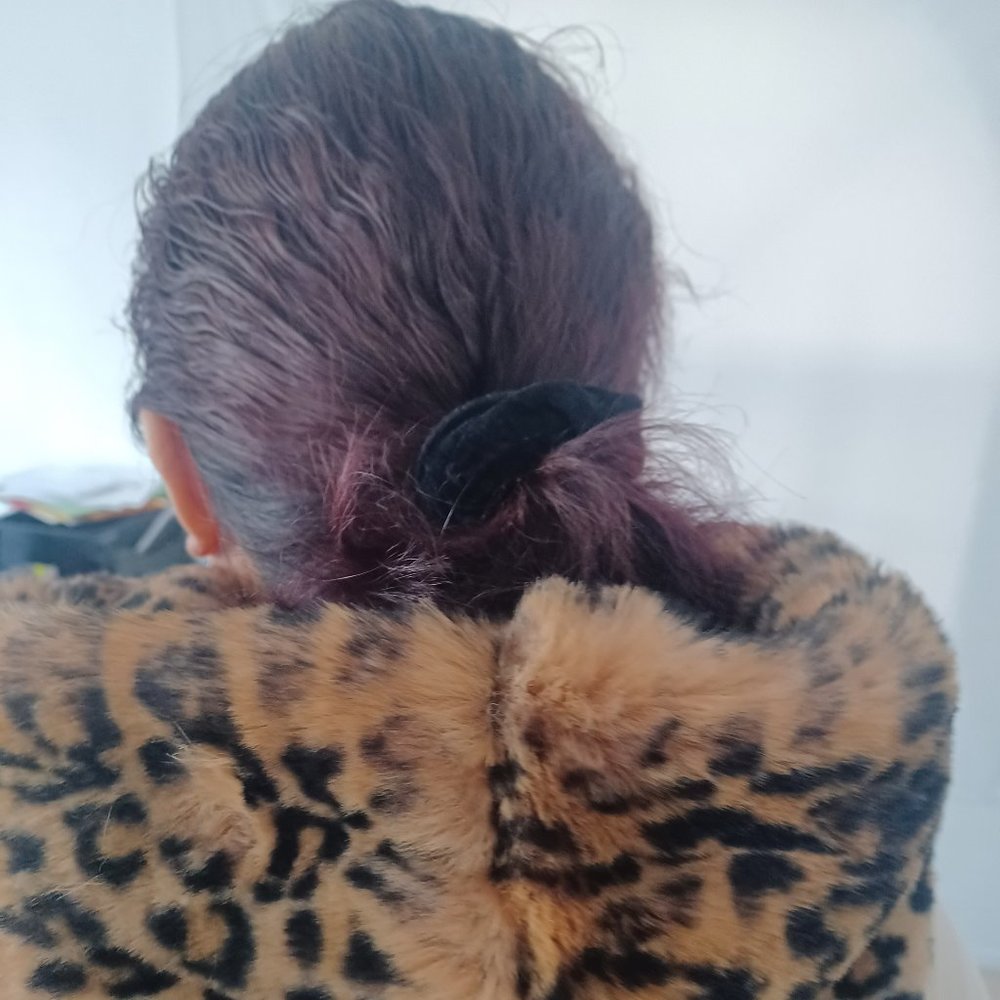 Women's hooded vest in faux leopard